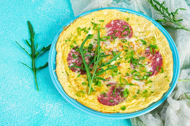 Omelette with sausage herbs and grated cheese Easy breakfast