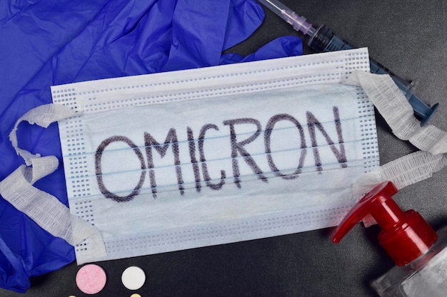 Omicron Concept, Face Mask with Sanitizer and Syringe