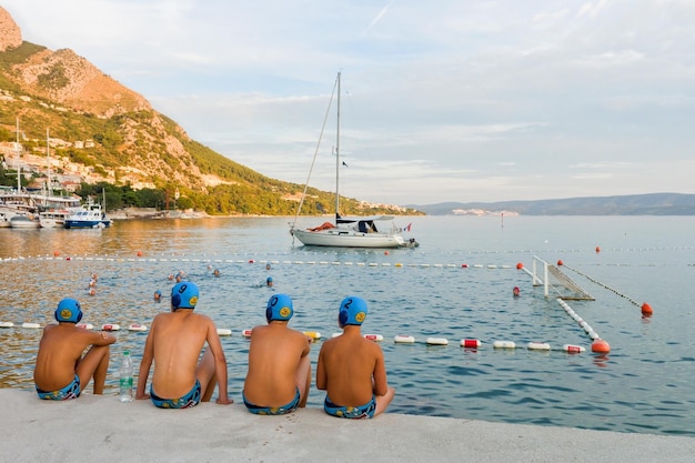 Omis, Croatia - August 17, 2016: Water polo reserve players watching the match in Omis, Croatia