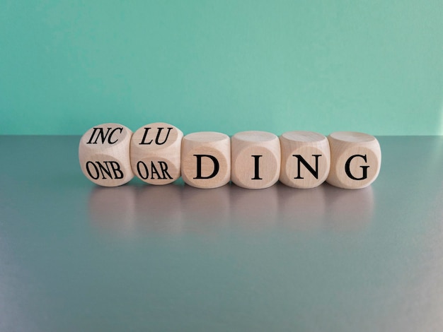 Onboarding and including symbol Turned wooden cubes and changed the word 'onboarding' to 'including'