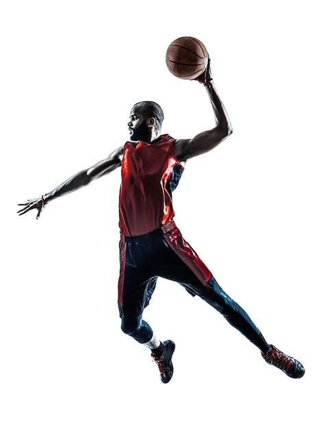 one african man basketball player jumping dunking in silhouette isolated white background