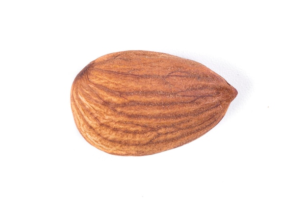 Photo one almond nut isolated on white background closeup macro