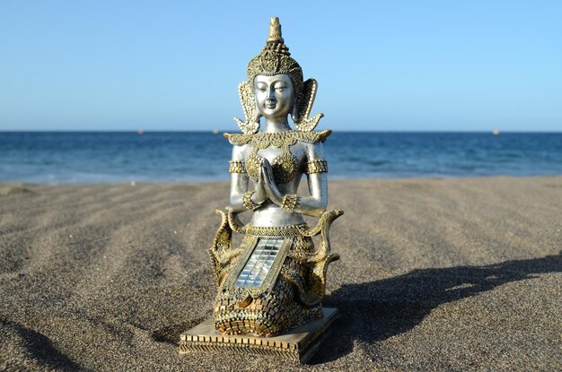 One Ancient Buddha Statue Near The Ocean