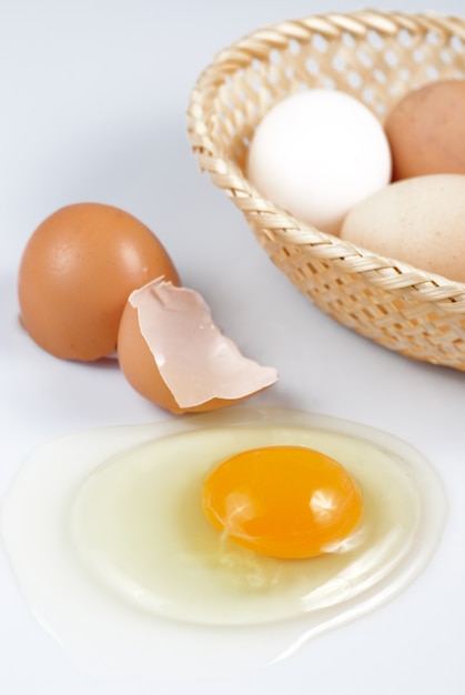 One beige cracked egg isolated on white