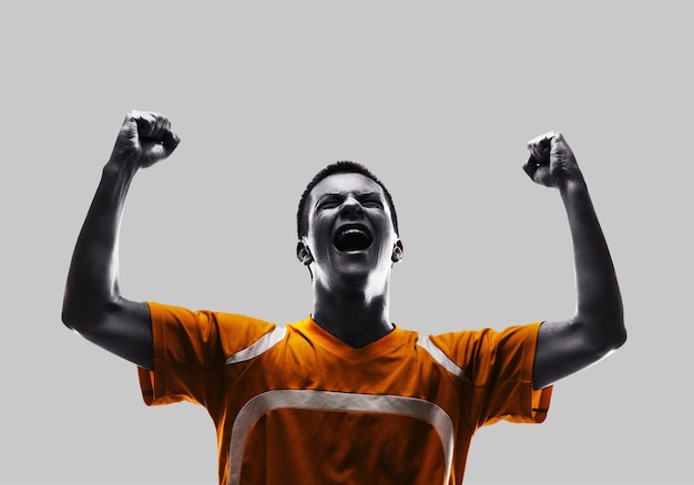 one brazilian soccer football player young man happiness joy pointing up  in silhouette studio