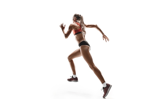 흰색 스튜디오 배경에서 달리고 점프하는 러너의 한 백인 여성 실루엣. 단거리 선수, 조깅하는 사람, 운동, 운동, 피트니스, 훈련, 조깅 개념.