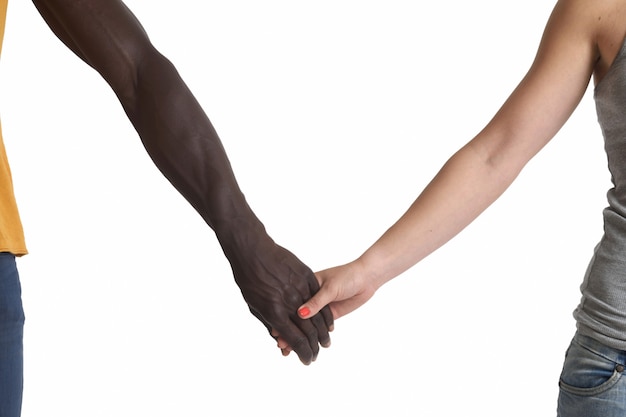 Photo one caucasian and one african hand on white background