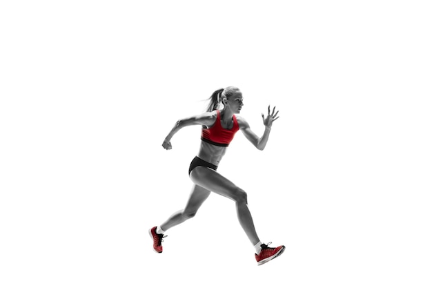 One caucasian woman running on white background