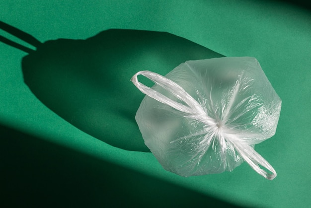 One cellophane bag on a green background