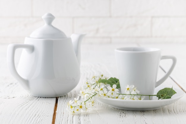 One coffee cup on white table in morning