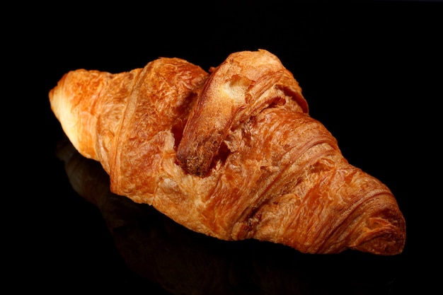 One Croissant on a dark