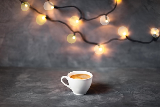 One cup of coffee on gray background