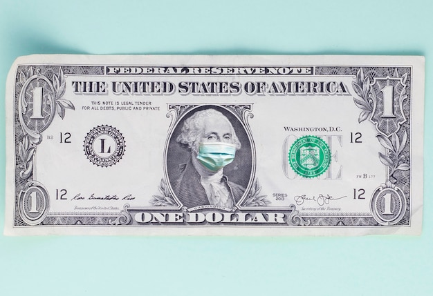 One dollar bill with medical mask