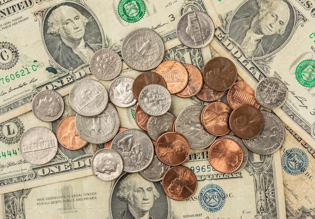 One dollar bills and cents coins spread