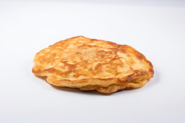 One fried pancake against the white background