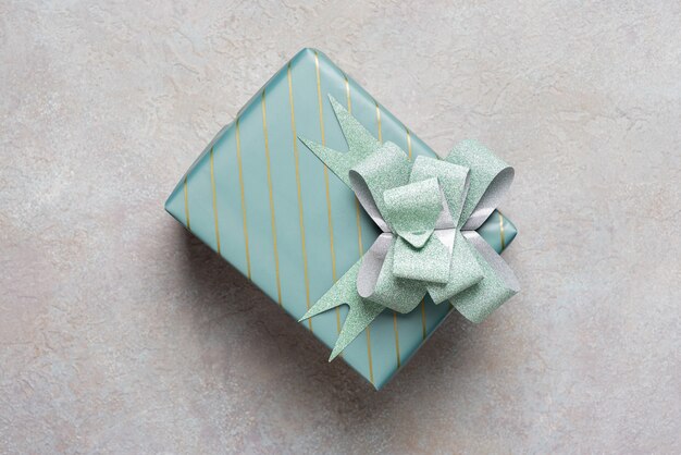 One gift box in turquoise packaging .