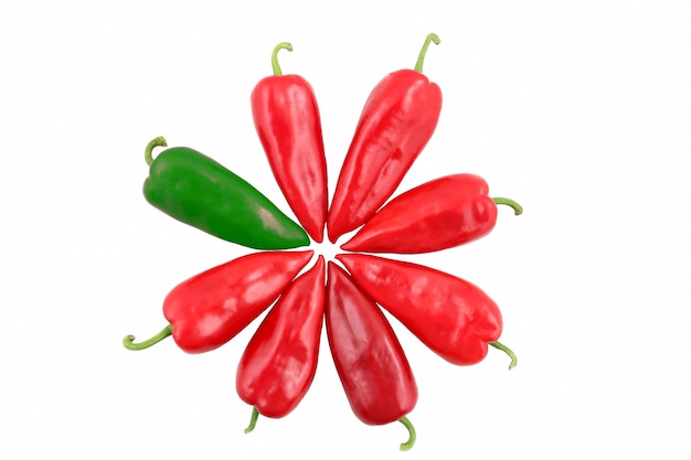 One green and seven red sweet peppers