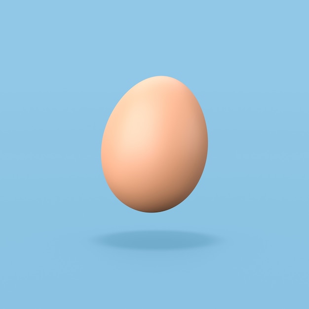 写真 青い背景の上の1つの鶏の卵