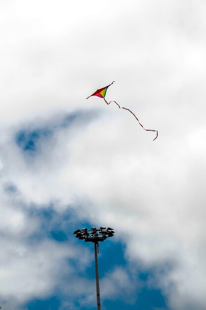 One Kite Flying over a Cloudy Sky