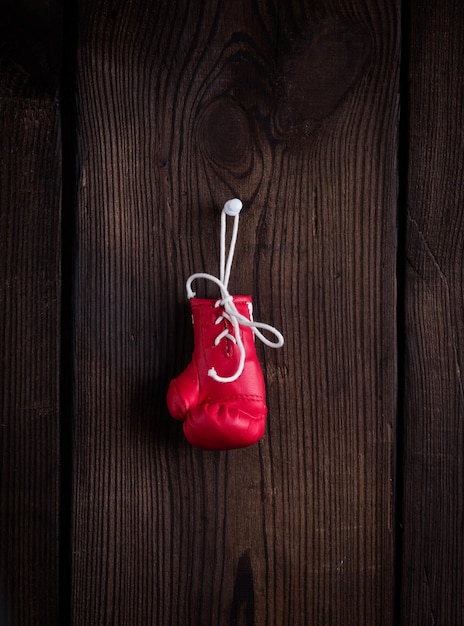 one leather red boxing glove with laces