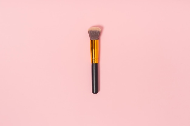 One makeup or facial brush isolated on a pink background