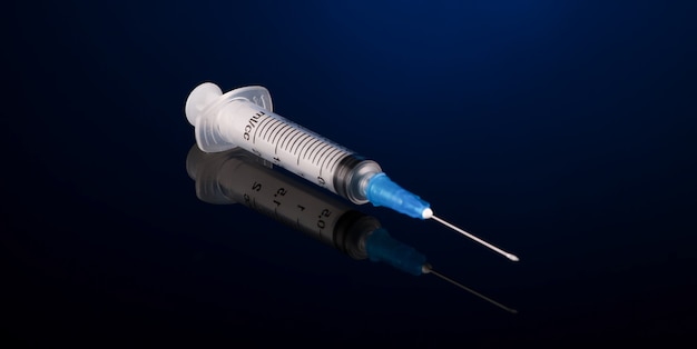 One medical syringe on a dark blue background with reflection