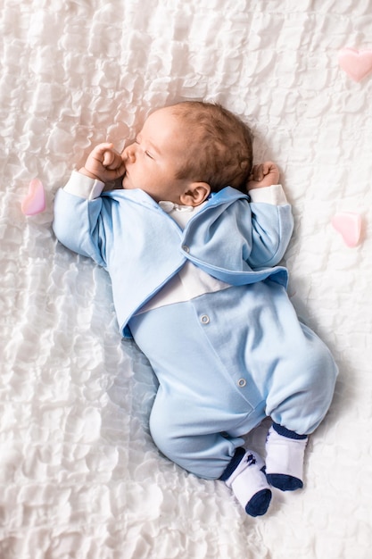 One month old baby girl on soft blanket