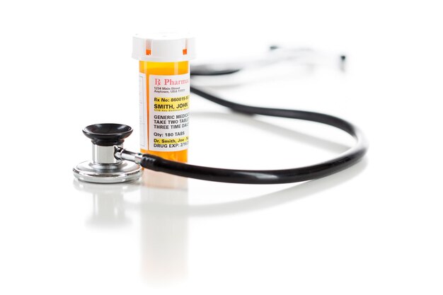 Photo one nonproprietary medicine prescription bottle with stethoscope isolated on a white background