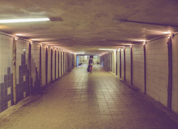 Photo one person in illuminated tunnel