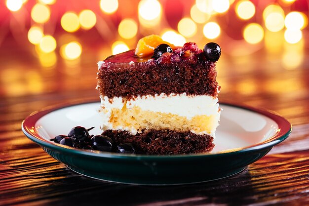 One piece of cake with cream chocolate with fruits