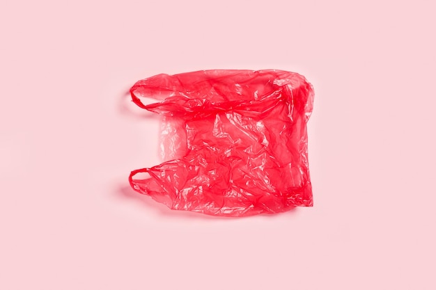 One plastic bag on pink background