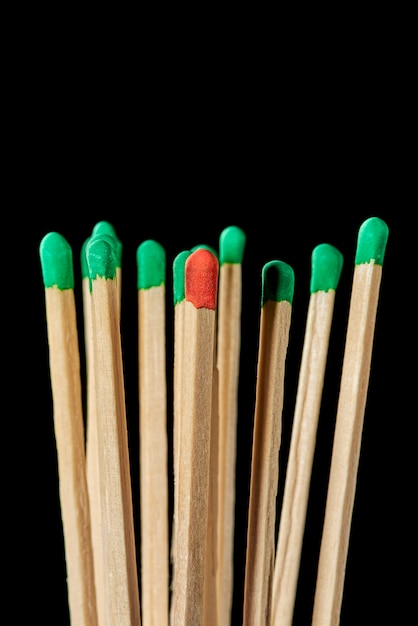 One red match in a group of green matches emotional burnout stress infection of others