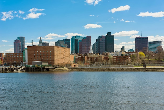 One of the riversides with tall buildings in the center of Boston in the United States. The city is one of the oldest in USA. It was founded in 1630 by Puritan settlers from England.