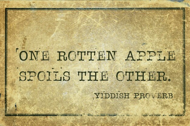 One rotten apple spoils the other ancient Yiddish proverb printed on grunge vintage cardboard