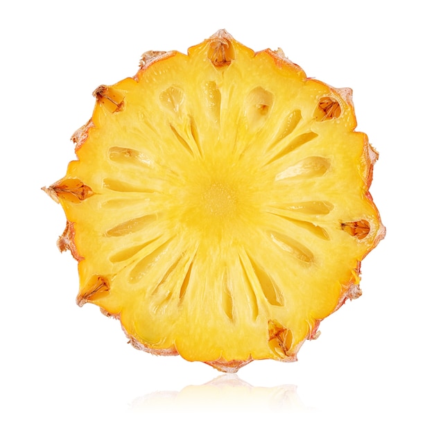 One round slice of ripe yellow pineapple isolated