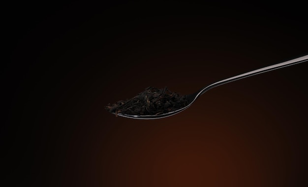 One spoon with tea leaves closeup on a burgundy background