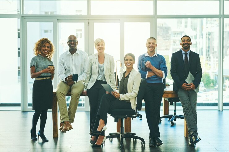 Photo one team with one big dream portrait of a group of businesspeople in an office