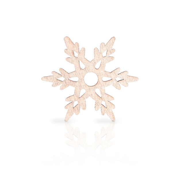 Photo one wooden carved snowflake isolated on white used as decoration at christmas or new year holidays