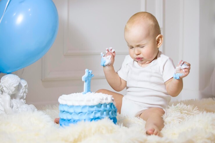 One year old child with a birthday cake First birthday