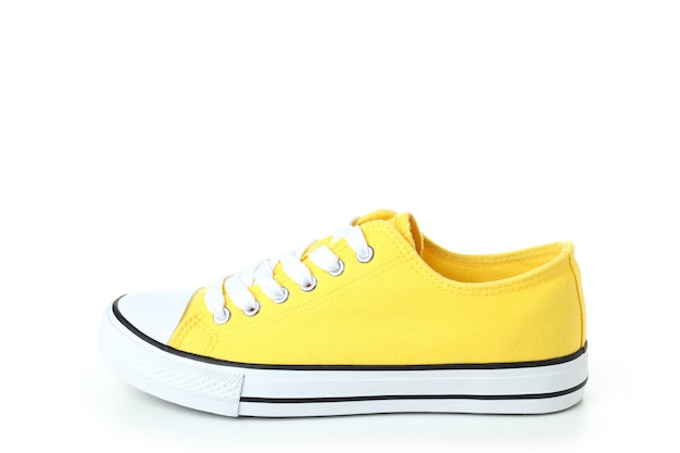 One yellow sneaker isolated on white background