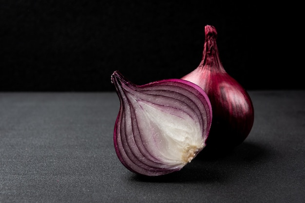 Onion on black background.