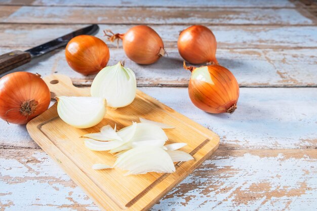 Onion cut on a wooden cutting board