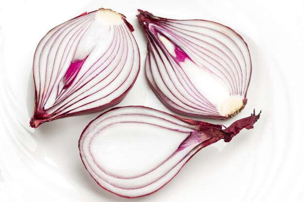 Onion halves on white background.