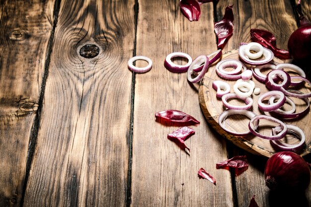 Onion rings with seeds on a wooden Board on wooden table.