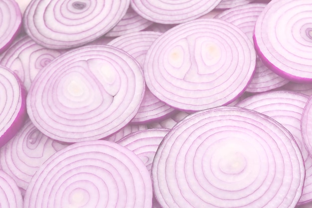 Onion slices as a background Top view