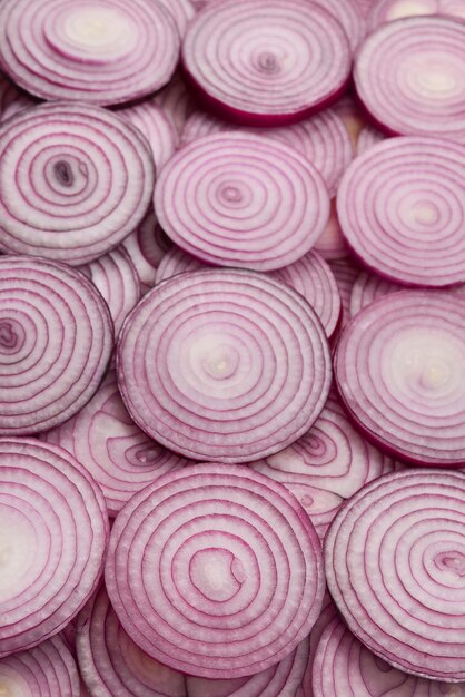 Photo onion slices as a background top view