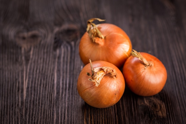 Onions on a wooden board