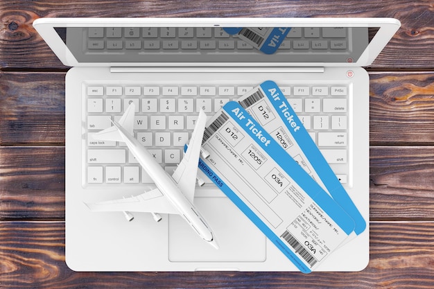 Online boekingsconcept. Airline Boarding Pass Tickets met Jet Airplane over Laptop op een houten tafel extreme close-up. 3D-rendering