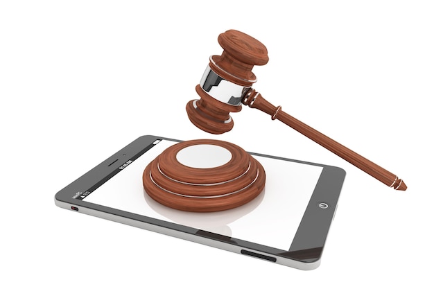 Online Business Concept. Tablet PC with a gavel on a white background