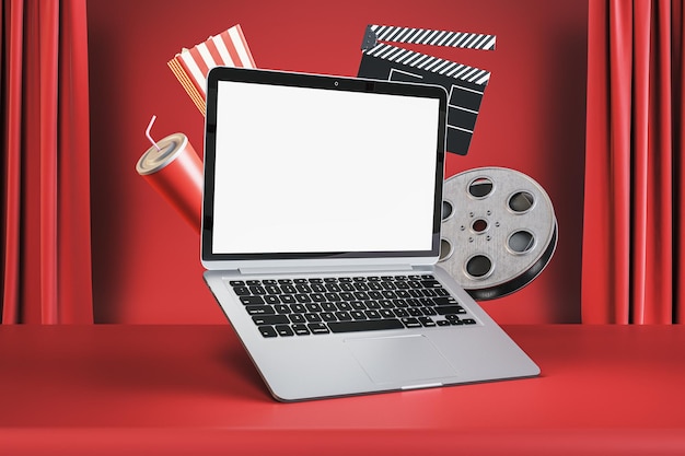 Online cinema movie watching concept with blank white modern laptop screen